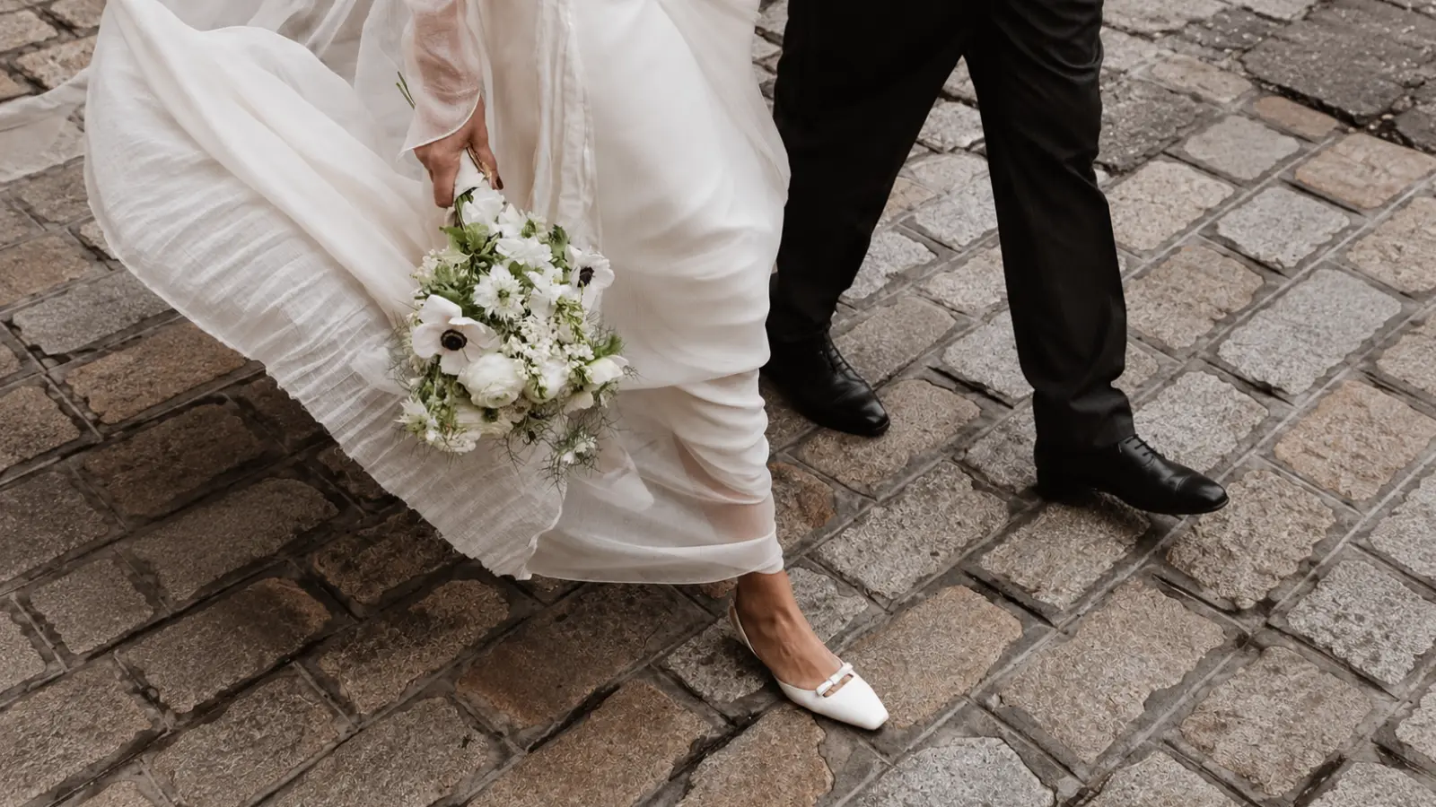 Bride and groom walking together after their wedding ceremony