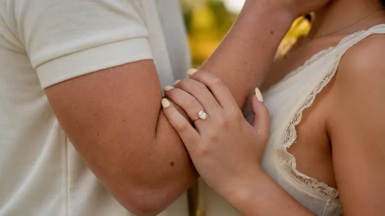 Couple embracing with an engagement ring visible while celebrating their 12th wedding anniversary 12th Wedding Anniversary Gift: Silk and Linen Ideas, Meaning and Modern Alternatives