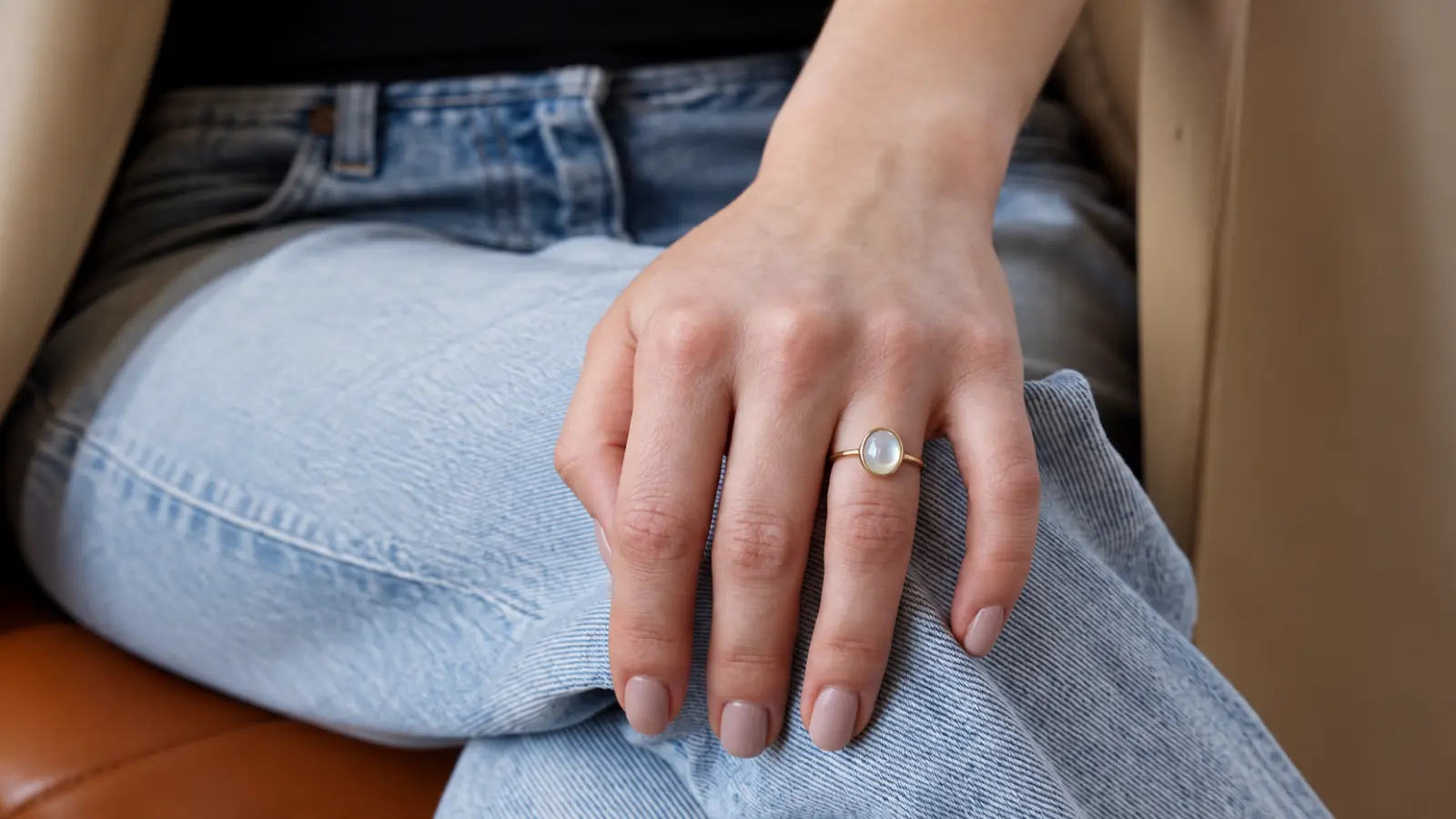 Gold ring with a luminous stone as a 14th wedding anniversary jewelry gift idea