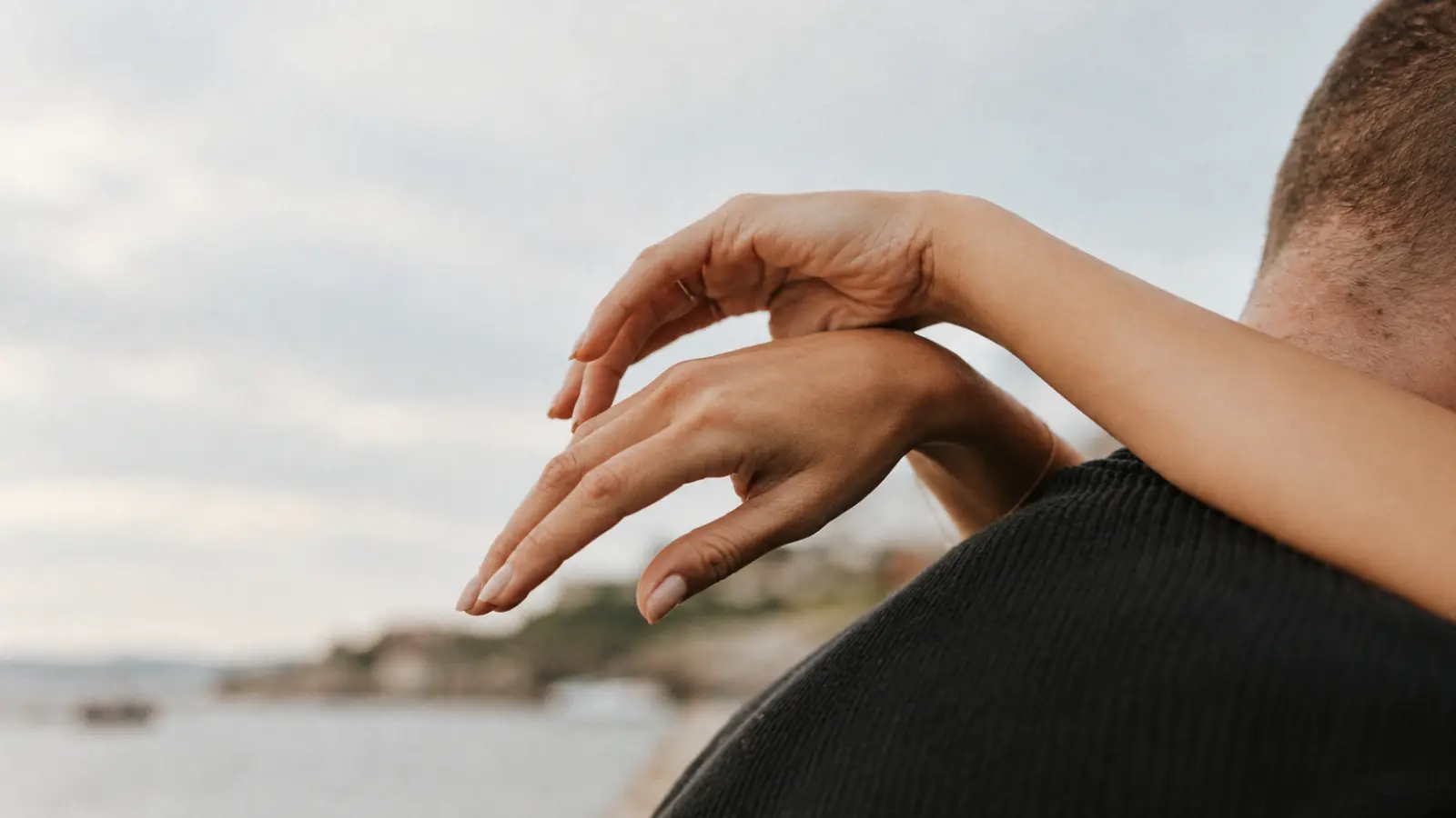 Couple embracing outdoors while celebrating their 14th wedding anniversary 14th Wedding Anniversary Gift: Ivory-Inspired Ideas, Gold Jewelry and Meaning